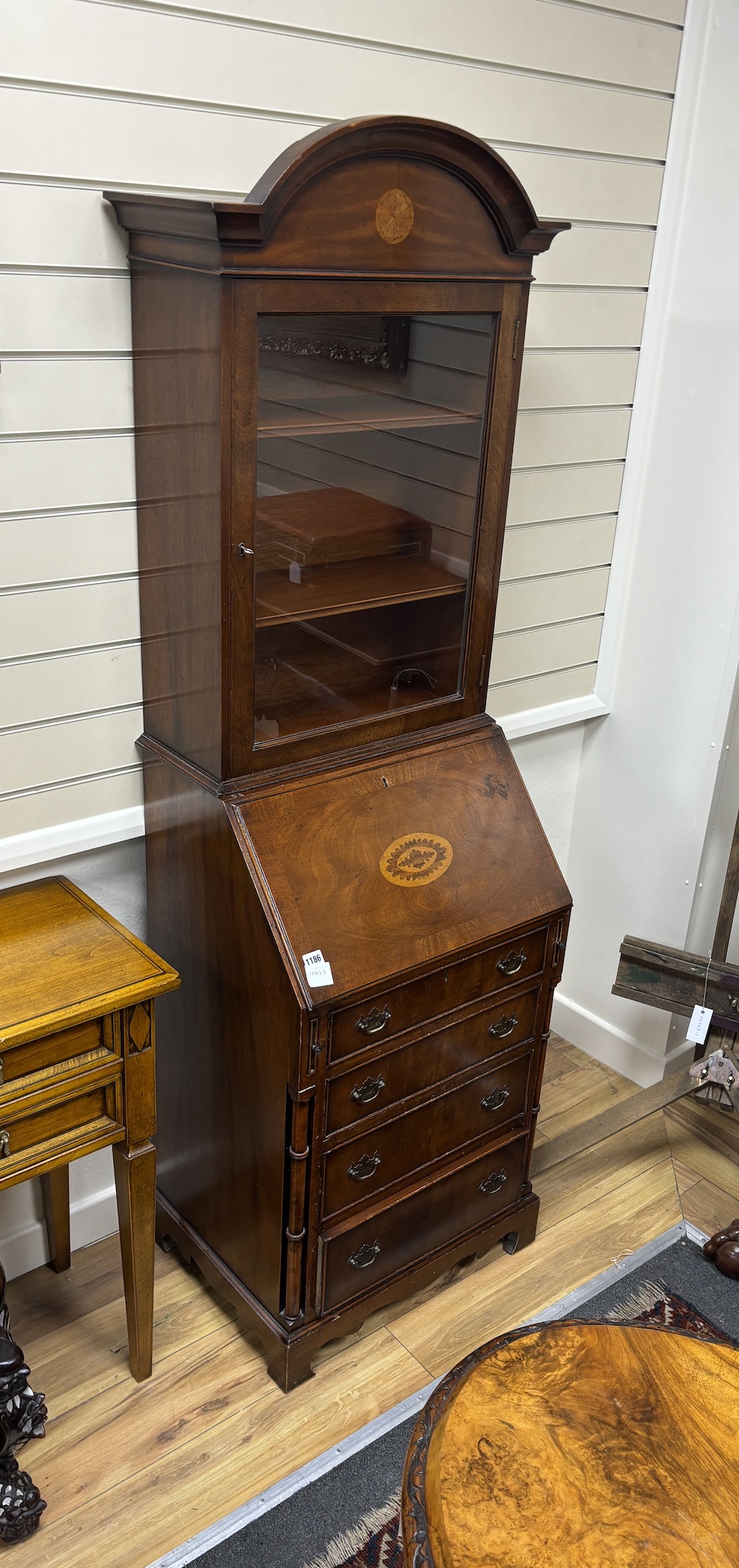 A reproduction George III style inlaid mahogany bureau bookcase, of narrow proportions, width 55cm, depth 44cm, height 184cm
